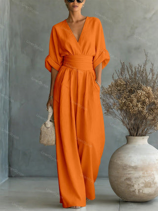Lumina | Elegante en getailleerde jumpsuit met diepe V-hals – Luxe Designer eendelig Pak Oranje