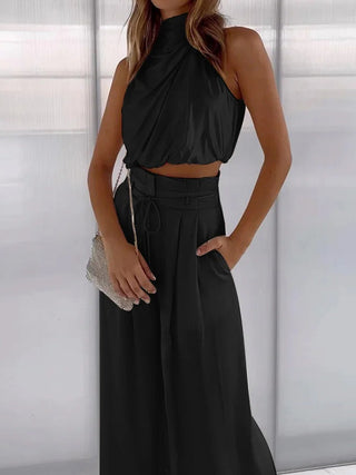 Luxe tweedelige set met elegante top en broek, geschikt voor feestjes en dagelijks gebruik. Zwart
