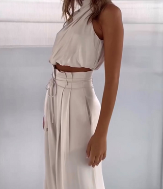 Luxe tweedelige set met elegante top en broek, geschikt voor feestjes en dagelijks gebruik.